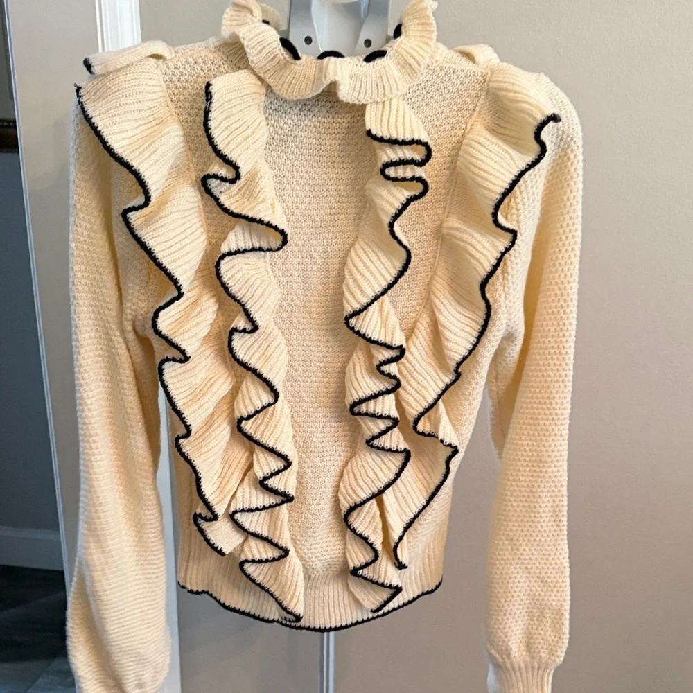 Stellah Ivory Sweater with Black Ruffle Accents